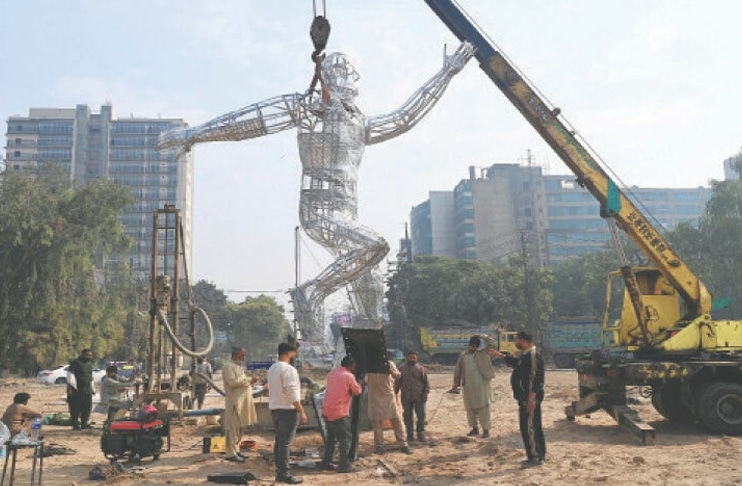 champions-trophy-running-man-statue-installed-gaddafi-stadium